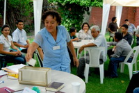 A delegate to this year’s national convention in El Salvador casts her vote 